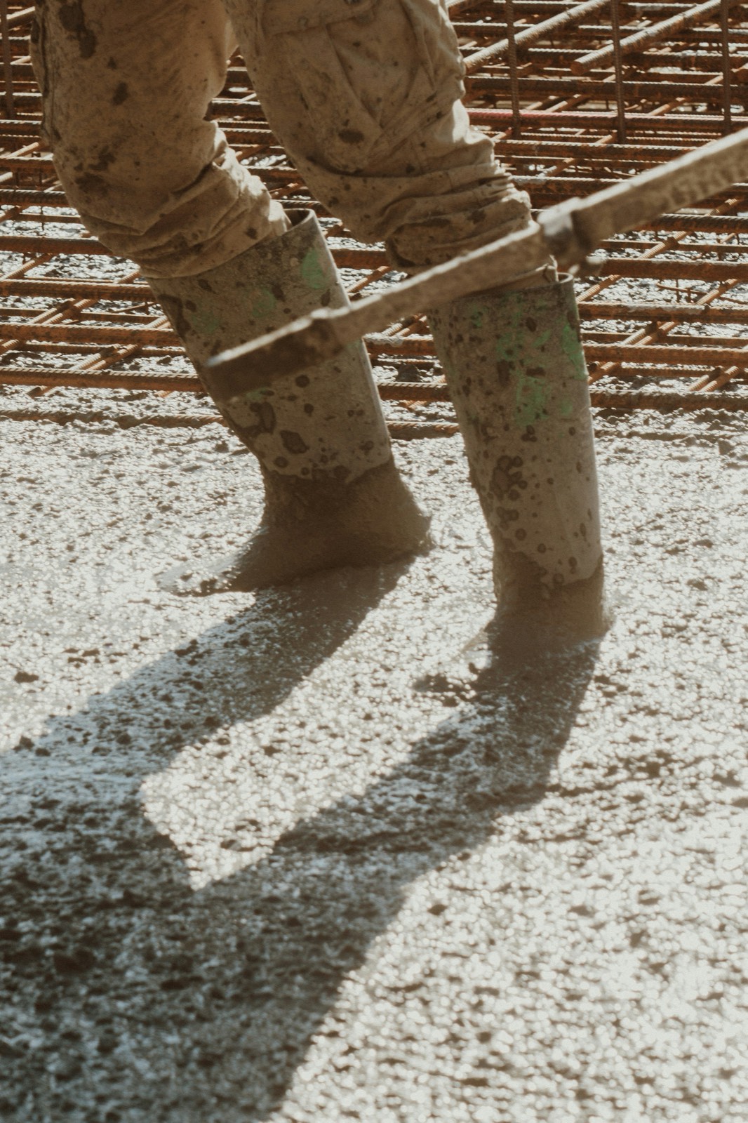 Boots standing in wet concrete